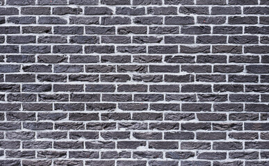 Texture of a black brick wall