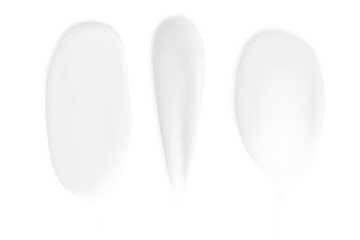 A set of different strokes of white cream on a blank background. PNG