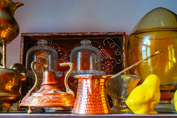 Turkish and and Arabic traditional copper coffee pots on the table, still life