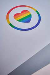 Rainbow heart on a light paper background. LGBT flag. LGBTQIA Pride Month in June. Lesbian gay bisexual transgender. Gender equality. Human rights and tolerance. rainbow flag