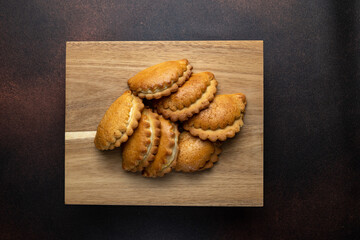 Delicious cookies on a wooden board. Close up