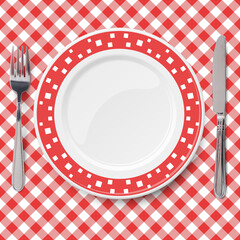 Red dish with pattern of chaotic white pattern placed on red check classic table cloth