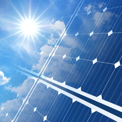 solar panels on blue sky and sun
