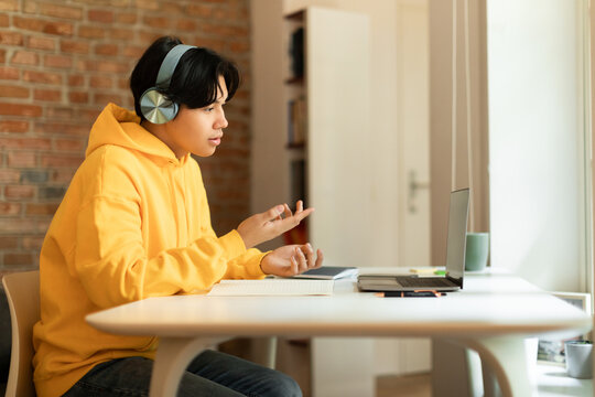 Asian Student Teenager Guy Video Calling Having Online Lecture Indoor