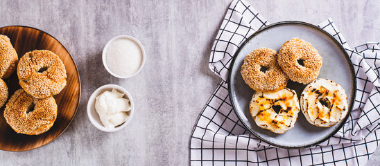 Sweet creme brulee bagels with cream cheese and caramelized sugar for breakfast top view web banner
