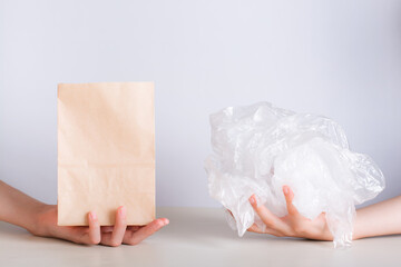 Choice between eco-friendly paper bag and disposable plastic bag - obrazy, fototapety, plakaty