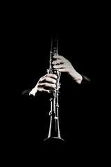 Clarinet player. Clarinetist hands playing woodwind isolated - obrazy, fototapety, plakaty