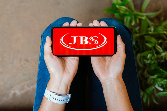 June 18, 2023, Brazil. In this photo illustration, the JBS S.A. logo is displayed on a smartphone screen.