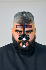 portrait of a dentist on a white background in eyepieces