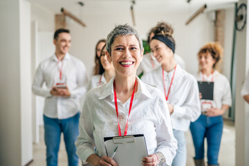 portrait of group of people colleagues at business conference seminar