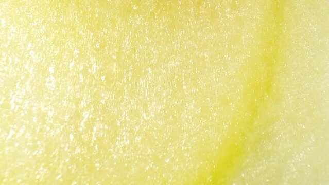 Moving further into the apple, the camera reveals the intricate pattern of the apple's flesh. Showcases the cellular structure, portraying the apple's organic composition in incredible detail. Macro
