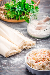 Baking preparation of savory pie with phyllo dough sheets stuffed with feta cheese