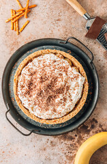 Banoffee pie with bananas, toffee, whipped cream and chocolate.