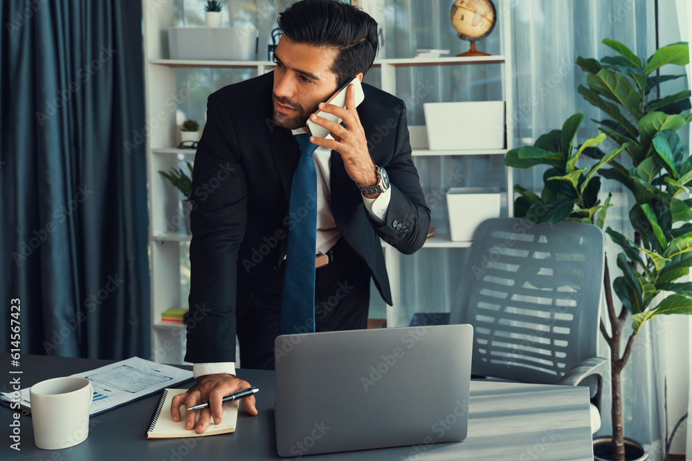 Aufkleber diligent businessman busy talking on the phone call with clients while working with laptop in his of