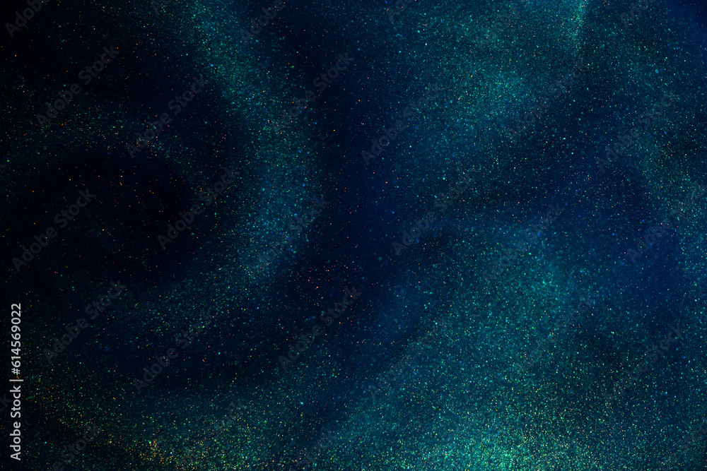 Canvas Prints a sparkling swirl of gold particles in blue liquid with green hues. countless tiny, shimmering gold 