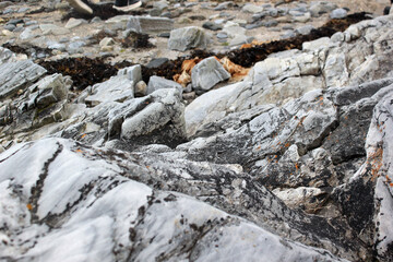 The texture of the stones, gray texture stones on the seashore in Norway