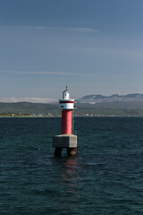 Sea, mountains, red buoy, sea route in Norway