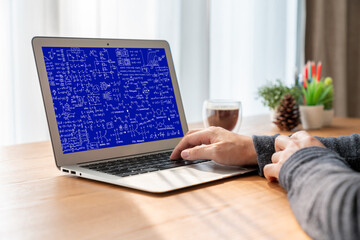 Mathematic equations and modish formula on computer screen showing concept of science and education