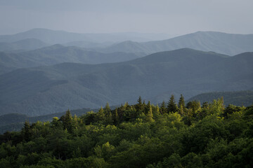 Stopping at an overlook along the Blue Ridge Mountains to see the endless views of the ridges and valleys - 614573620