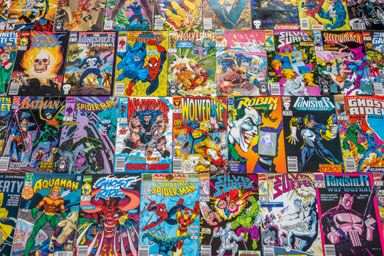 Calgary, Alberta - June 17, 2023: Covers of a variety of Marvel and DC comic books.