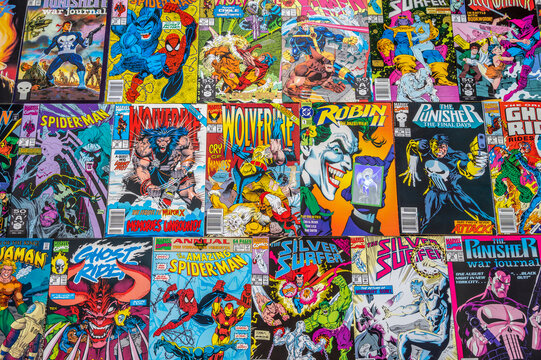 Calgary, Alberta - June 17, 2023: Covers of a variety of Marvel and DC comic books.