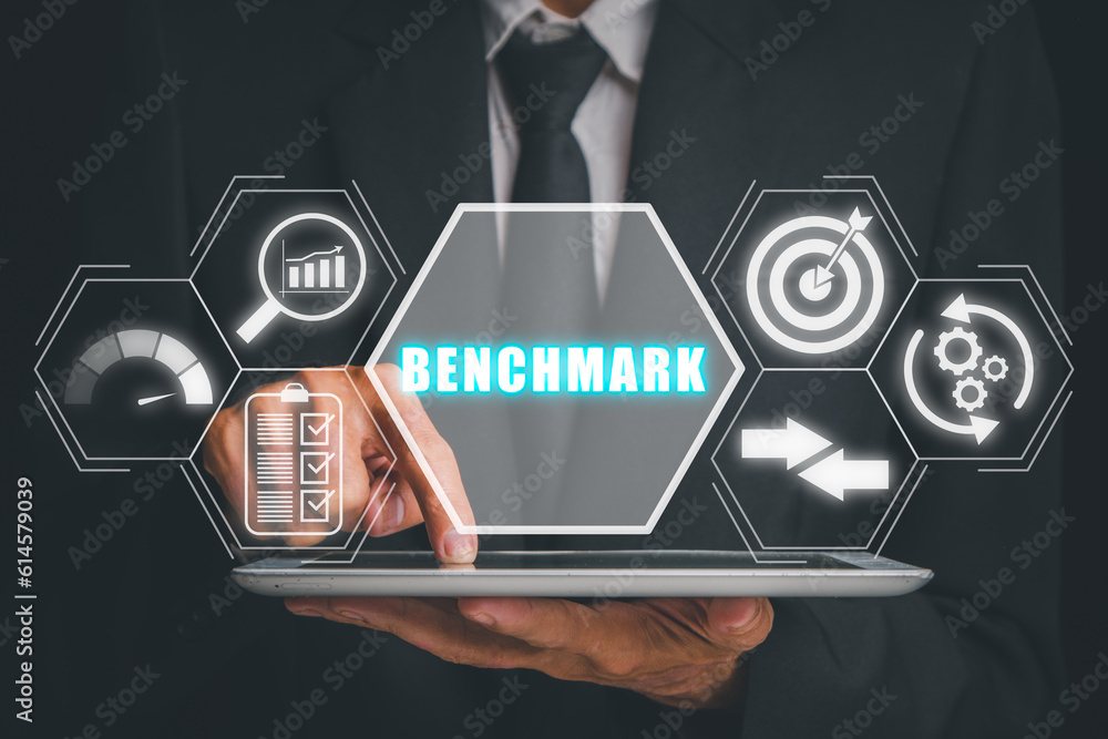 Poster benchmarking concept, businessman hand touching on tablet computer with benchmarking icon on virtual