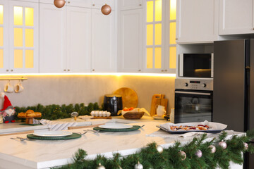 Cozy spacious kitchen decorated for Christmas. Interior design