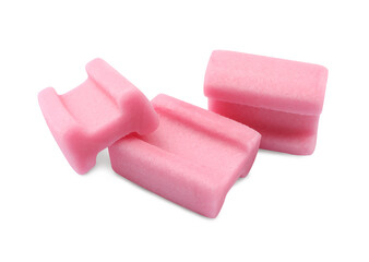Tasty pink chewing gums on white background