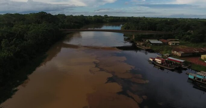 Larger River Flowing Under a Bridge that Connects two Villages across a Dense Vegetation in the Amazon Rainforest in Pando, Bolivia