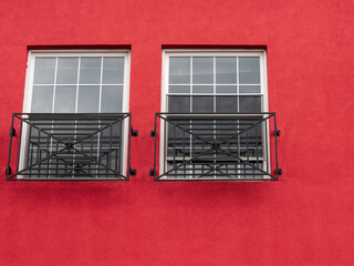 Windows and Red Stucco Wall