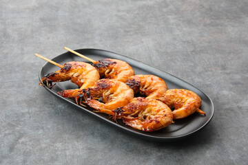 Udang Bakar Madu, Grilled Shrimp with honey, made from shrimp seasoned with chilli sauce, pepper...