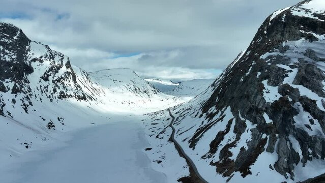 Mountain road FV 63 in Norway leading to Geiranger fjord - Winter closed road seen in May spring moth ready for opening - Langvatnet lake to the left - Aerial