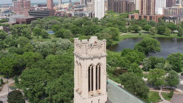 Descending aerial close-up shot of the belltower at Saint Mark's Episcopal Cathedral in Minneapolis, Minnesota. 4K