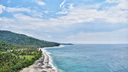 the beauty of the beach in lombok seen from the top of the hill