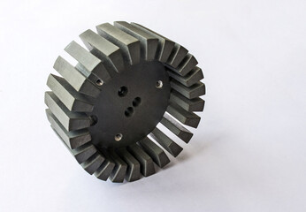 Round metal heatsink with cooling fins for high power transistor with threaded holes. Isolated on white.