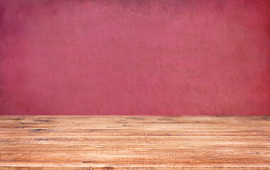 Wooden table top on grunge pink wall background, product display montage