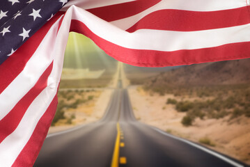 United States flag and road through the American desert