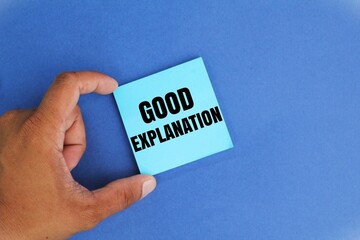 hand holding colored paper with the word good explanation. good explanatory concept