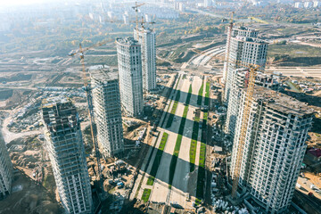 aerial panoramic view of large construction site. new modern high-rise apartment buildings under construction.