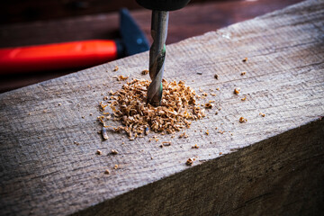 wood drill close-up on a wooden background