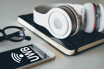 Wireless connection between mobile phone and wireless headphones, UWB concept, ultra wideband.