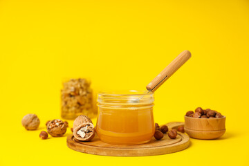 Concept of tasty and sweet food - honey with nuts
