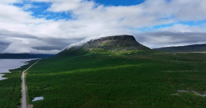 Aerial tracking shot of clouds on the famous Saana fell, summer in Lapland, Finland