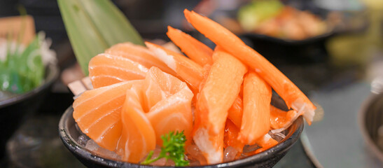 Fresh Japanese Sashimi set in Asian restaurant, orange Salmon and tuna sashimi fish on dish with ice. Japan food concept
