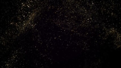 Goldem particles moving in slowm otion on black background 4k footage, Gold litters footage, particles moving footage