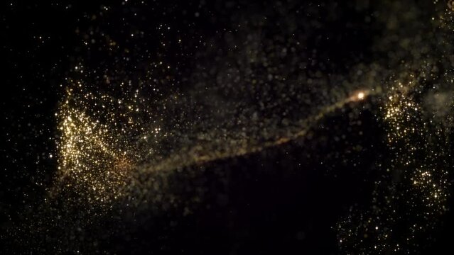 Golden particles moving in slow motion on black background 4k footage, Gold litters footage, particles moving footage. Glitters backdrop, awards background, 