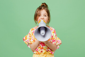Little child kid girl 6-7 year old wearing casual clothes hold in hand megaphone scream announces...