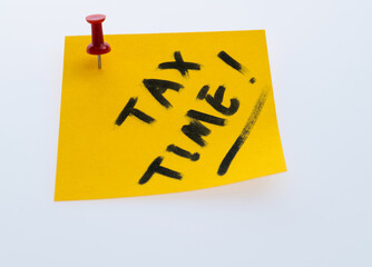 Tax time written on sticky note