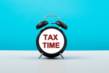 Alarm clock face with text tax time