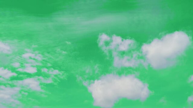 The green screen of moving white clouds with 4K resolution. Can use to change the background color.